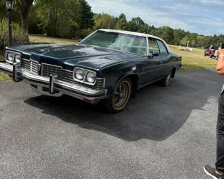 It’s a 1973 Pontiac Bonneville with 63,000 miles and a pristine white interior.