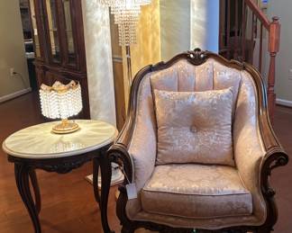 Marble top tables, elegant furniture, and chandelier lamps