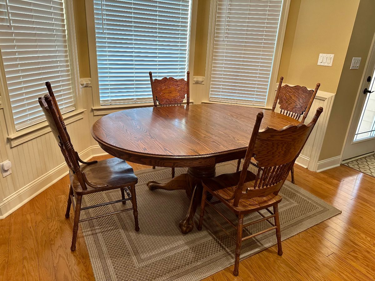 Kitchen table w/ chairs and area rug