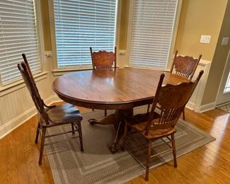 Kitchen table w/ chairs  and area rug 