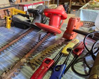 Power Edgers - Trimmers - Chain Saw in Garage
