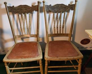 pair of pressed leather chairs