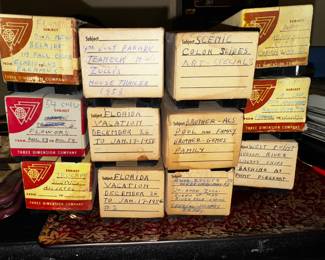 slides with descriptions.. also another pile of slides in round trays.. 