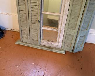 Faux window with shutters.