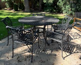 6-Piece Wrought Iron Outdoor Dining Set. 
