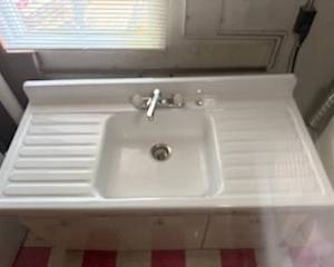 Vintage Sink Excellent condition 54x36 sitting on American Kitchens metal cabinet