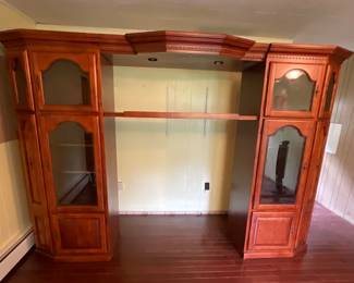 Solid wood entertainment center. Display towers can be used separately and center section is adjustable.