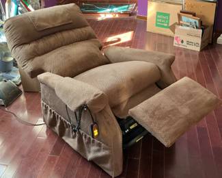 Recliner lift chair by Gold with remote control.  Originally $1600.  Like new.