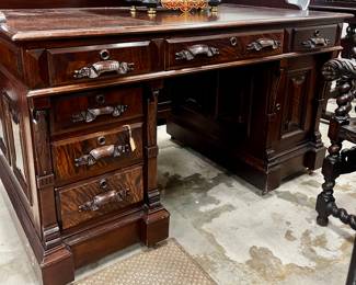 This desk has a paneled back so it is stunning on all sides. It also has a secret door. Somebody will have a gorgeous office!