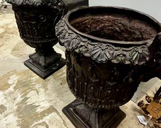pair of cast iron urn planters. Just beautiful