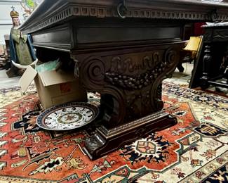 Really nice table/desk with carved sides. Glassware that stuns and a nice looking area rug.