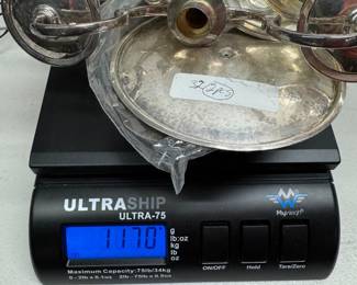 1170 grams of sterling silver. (solid, not weighted)