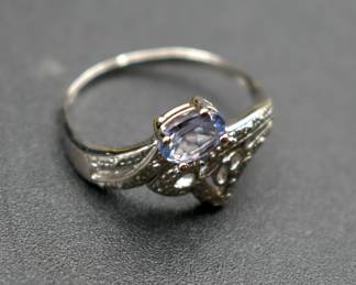 Natural tanzanite and diamond accent designer ring