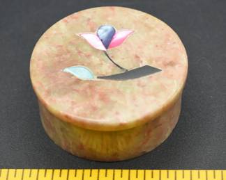 round stone trinket box with inlaid colored flowers