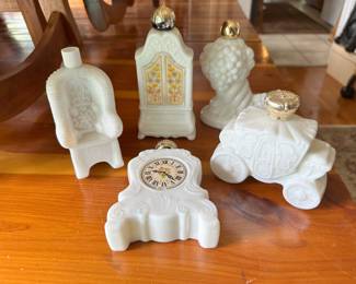 Avon collectable milk glass bottles.