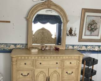 Elegant traditional dresser with ornate mirror, light cream/ivory wash with gold undertones