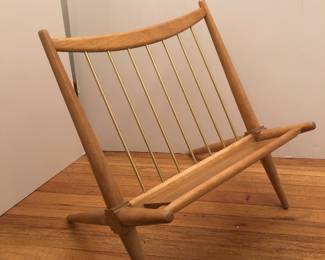 1960’s wood and metal magazine rack in the style of Robsjohn Gibbings.