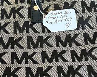 K23 - $30. Michael Kors Canvas Tote. Measures 14.75" x 4.75" x 9" tall. 