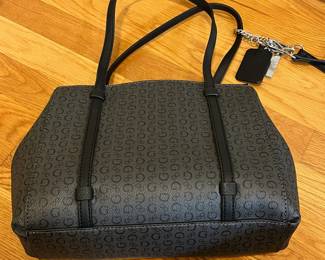 K26 - $25. New Guess Black and Grey Purse. Measures 12" x 4" x 8.5". 
