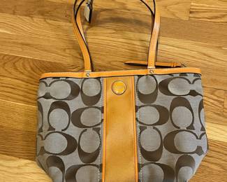 K24 - $25. Vintage Coach Canvas Khaki and Orange Tote with Dust Cover. Measures 14" x 4" x 10"