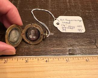 M8 - $95. Antique Daguerreotype Locket. Measures 1 1/8" across. Monogramed "MEC". Gold Filled. 