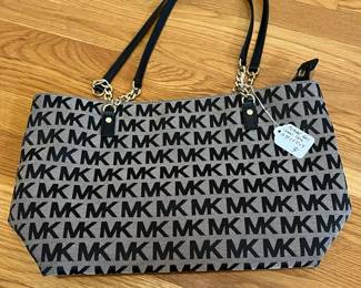 K23 - $30. Michael Kors Canvas Tote. Measures 14.75" x 4.75" x 9" tall. 