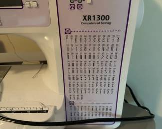 G7 - $100. Brother XR1300 Sewing Machine. Includes power cord, foot pedal & books. 