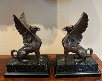 L34 - $30. Set of Vintage Bronze Griffin Bookends. Measures 6.25" x 4" x 9" tall. Faux Marble Base. 