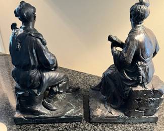 L24 - $60. Austin Reproductions Japanese Geisha and Man Playing Shamise Figures/Bookends  - Signed "Lioo" Measures 6.5" x 11" tall. 