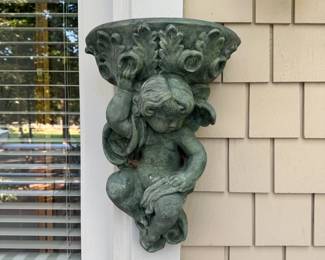 G17 - $50. Heavy concrete cherub outdoor planter / fountain. Has wire to hang. Approximately 18" tall. 