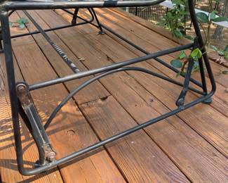 G12 - $125. Wrought Iron Glider Rocker in good condition - there is a bit of minor rust on the bolt areas. Measures 45" wide x 29" deep x 37" tall. Floor to seat is 18"