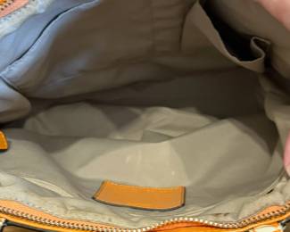 K24 - $25. Vintage Coach Canvas Khaki and Orange Tote with Dust Cover. Measures 14" x 4" x 10"