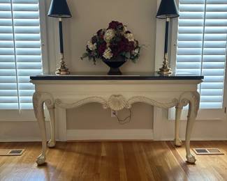 L5 - $250. Marble Top Sofa Table. Off white color painted solid wood - the marble is attached and will be quite heavy to move! Measures 59.5" x 19" x 33" tall. 