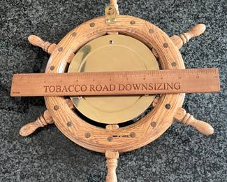L46 - $40. Vintage Nautical Brass Porthole Clock in Wood Ship Wheel. Measures 13" across. 