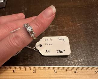 M11 - $250. Size 6. 14kt Engagement Ring. Beautiful setting and center diamond. Both side diamonds have been carefully removed. 