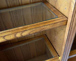 G5 - $150. Lighted Display Case / Bookshelf. Measures 48" x 15" x 84" tall. Center shelf is fixed the 8 other shelves are wood framed with glass inserts. All are adjustable. 