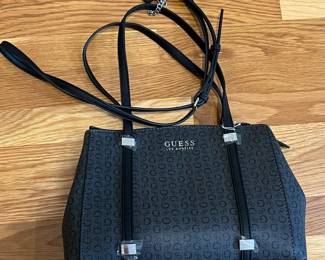 K26 - $25. New Guess Black and Grey Purse. Measures 12" x 4" x 8.5". 