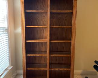 G5 - $150. Lighted Display Case / Bookshelf. Measures 48" x 15" x 84" tall. Center shelf is fixed the 8 other shelves are wood framed with glass inserts. All are adjustable. 