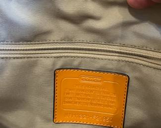 K24 - $25. Vintage Coach Canvas Khaki and Orange Tote with Dust Cover. Measures 14" x 4" x 10"