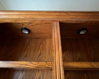 G5 - $150. Lighted Display Case / Bookshelf. Measures 48" x 15" x 84" tall. Center shelf is fixed the 8 other shelves are wood framed with glass inserts. All are adjustable. 