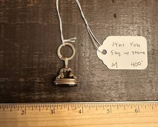 M6 - $400. 14kt Fob with stone. Hanging ring is bent. 
