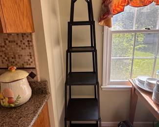 72” metal tower stand. Can be used for plants, Knick knacks,  Cookbooks, use in a bathroom for towel sets, etc.  