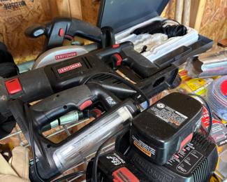 Multiple rechargeable tools, small skill saw, light.