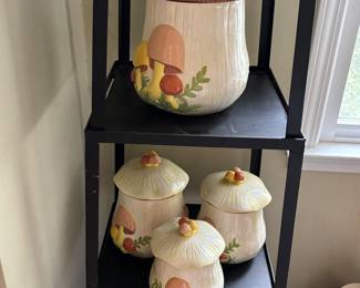 Vintage ceramic canisters with mushrooms. Very stylish.  And four snap on blue lids. 