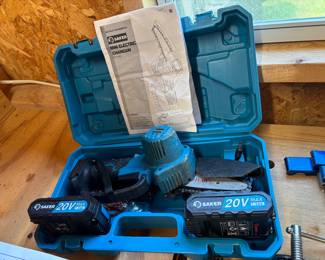 Mini Electric chainsaw with 2 rechargeable batteries with carrying case.