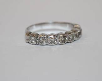 14kt white gold diamond Anniversary Band featuring 7 round bezel set diamonds approx .75ctw, size 6.75, 3.5 grams total weight, very nice and well designed piece of jewelry