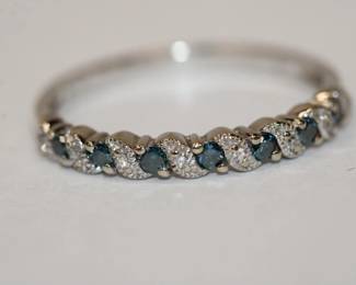 10kt Sapphire & Diamond Band Ring that features 7 round sapphires separated by round diamonds total weight of all gemstones is approx .50ctw, size 8.75, 1.9 grams total weight