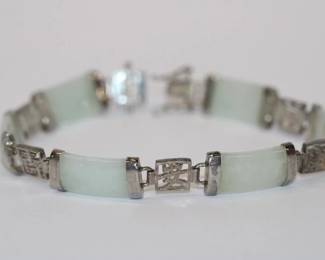 .925 Sterling Chinese Jade Bracelet with 6 light green Jade sections divided by sterling sections with Chinese writing and double locking safety clasp, 7" long, 13.6 grams tota weight