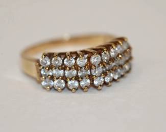 10kt yellow gold Clear Stone Cathedral style Ring that is made up of 27 round clear stones that test betwen spinel and sapphire? using piesidium gem tester, pretty ring that is a size 7, 3.7 grams total weight