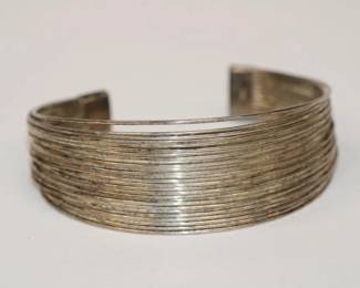 .925 Sterling Cuff Bracelet composed of many strands of sterling very unique design signed .925 and weighs 26.5 grams total weight
